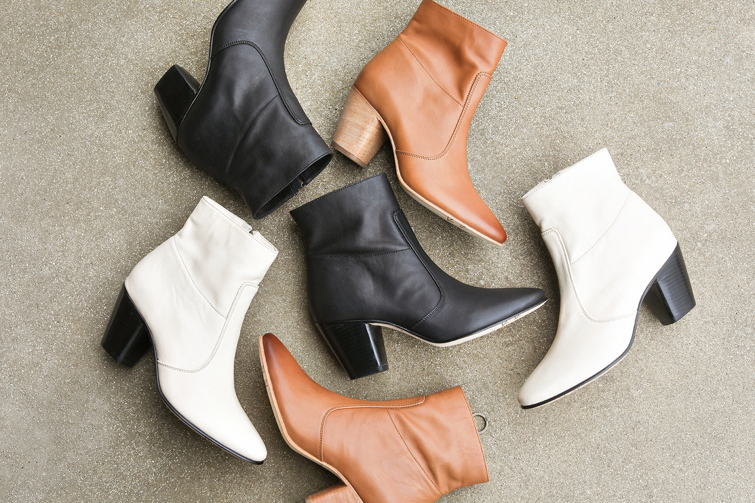 Group shot of Catbird leather boots in black, tan, and eggshell.
