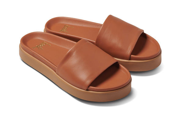 Chick leather platform slide sandals in tan - angle shot