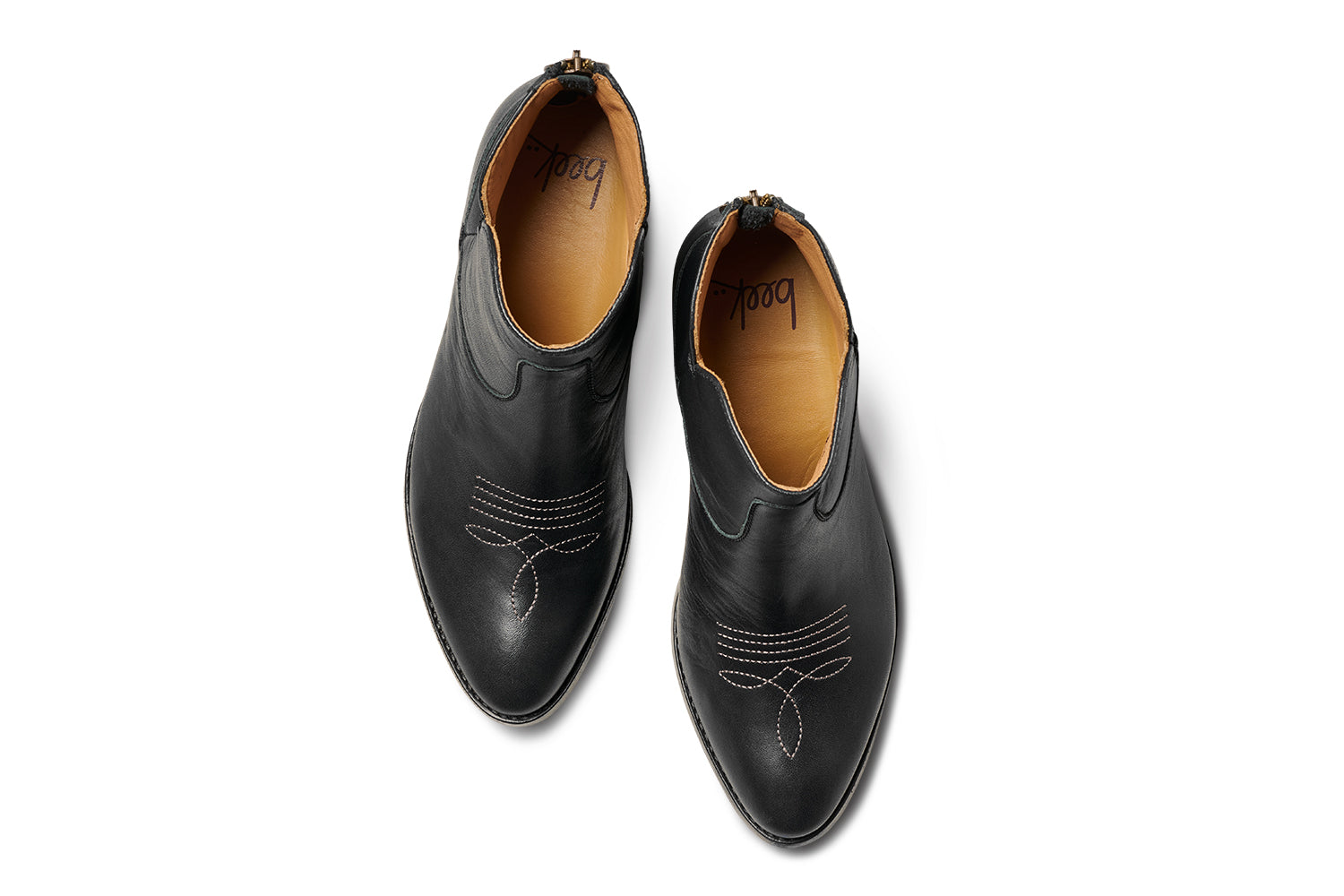 Cowbird leather boot in black - product top shot