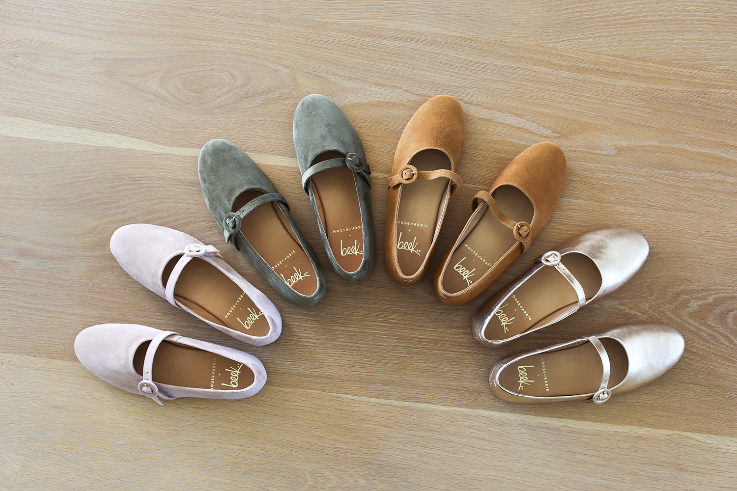 Group shot of Crane velvet mary jane shoes in blush, sage, caramel, gold