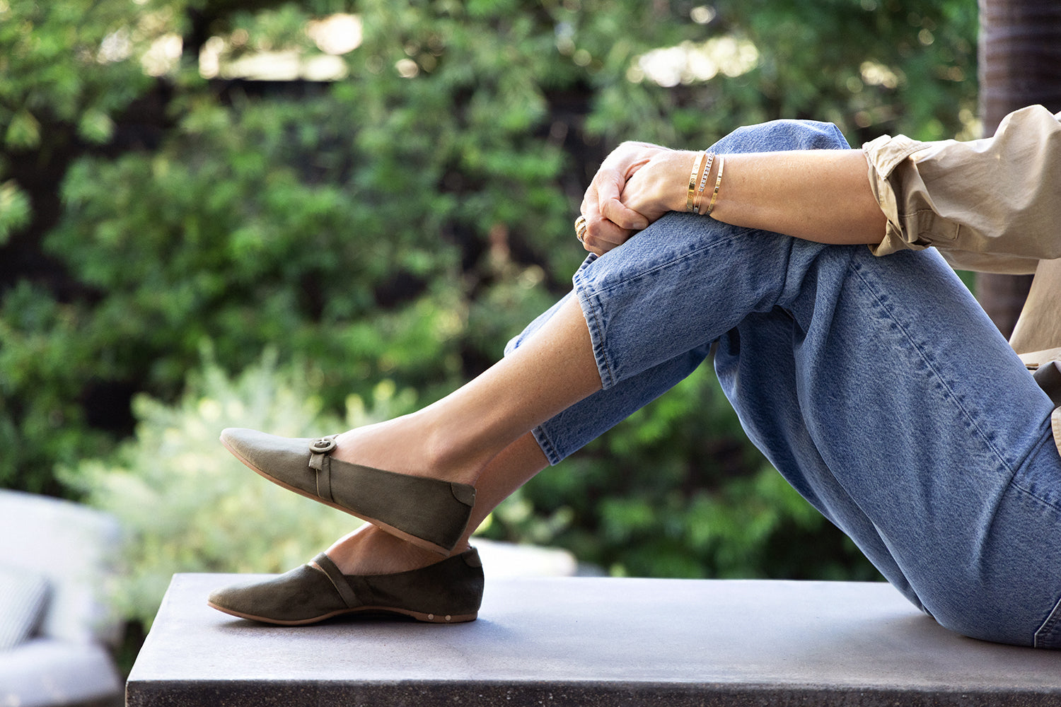 Abbie Crane wearing Crane velvet mary jane shoes in sage with jeans