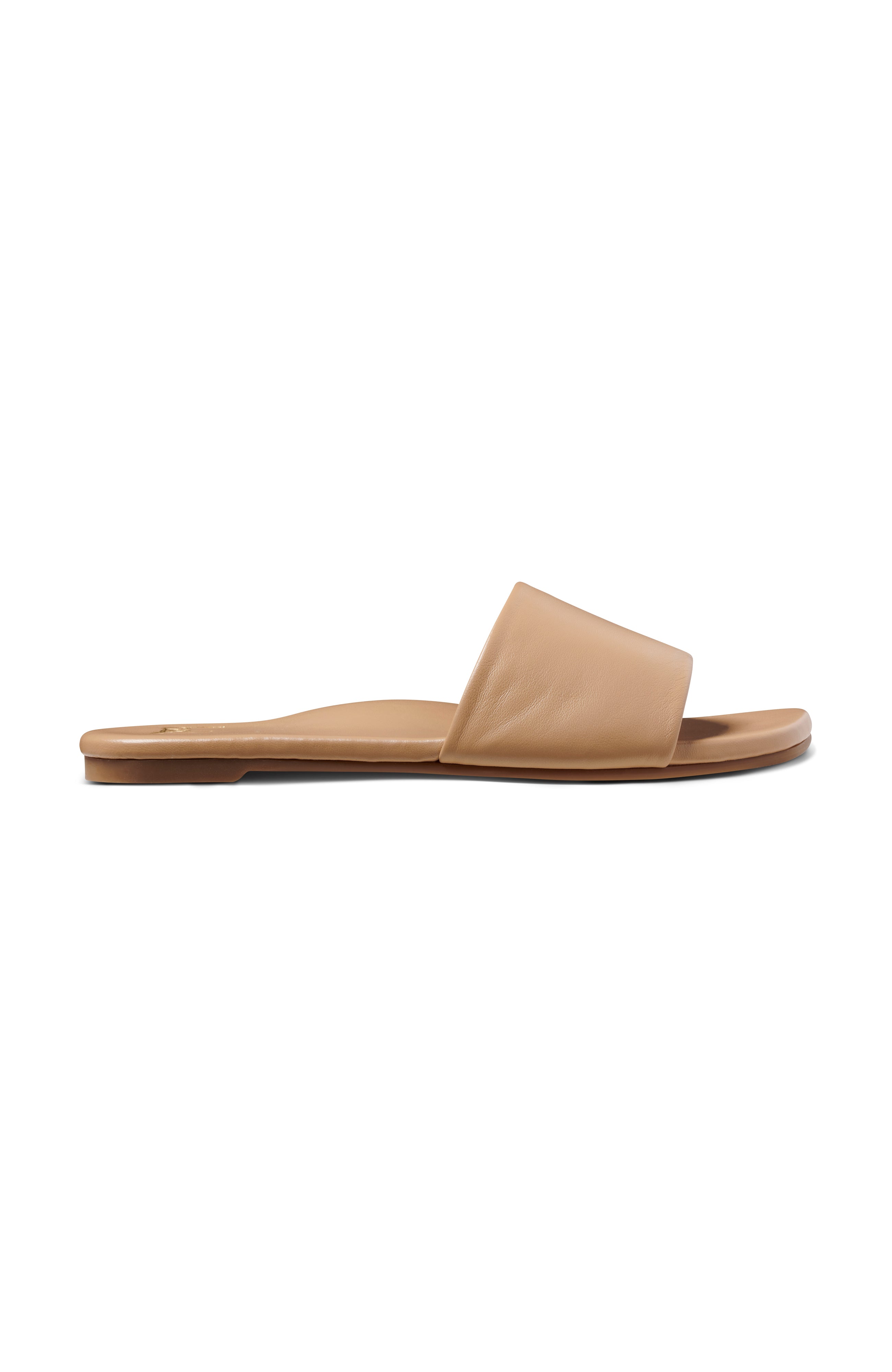 Honeybird leather slide sandals in beach - outer side shot