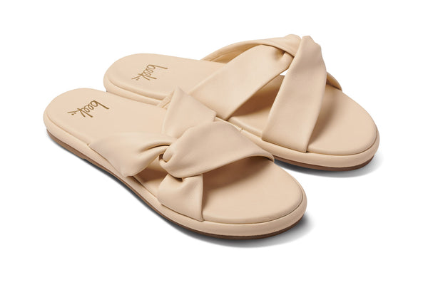 Piculet twisted leather slide sandals in macadamia - angle shot
