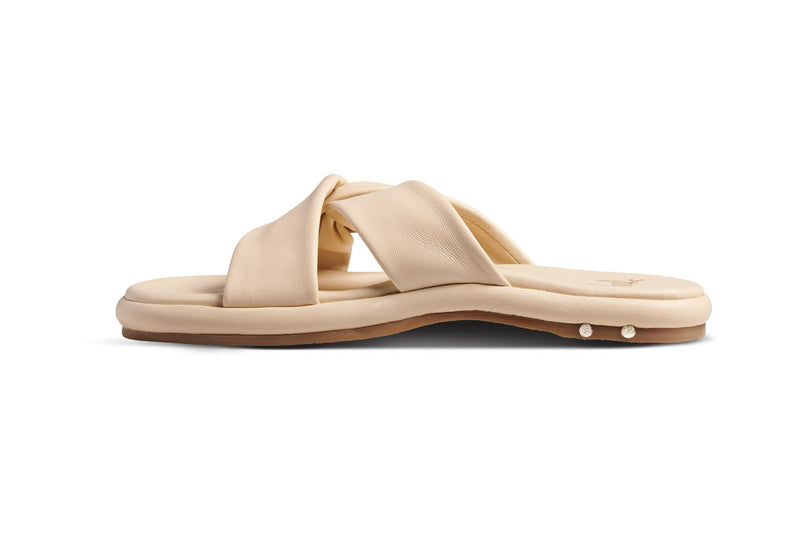Piculet twisted leather slide sandals in macadamia - side shot