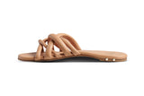 Puffback leather slide sandal in beach - side shot