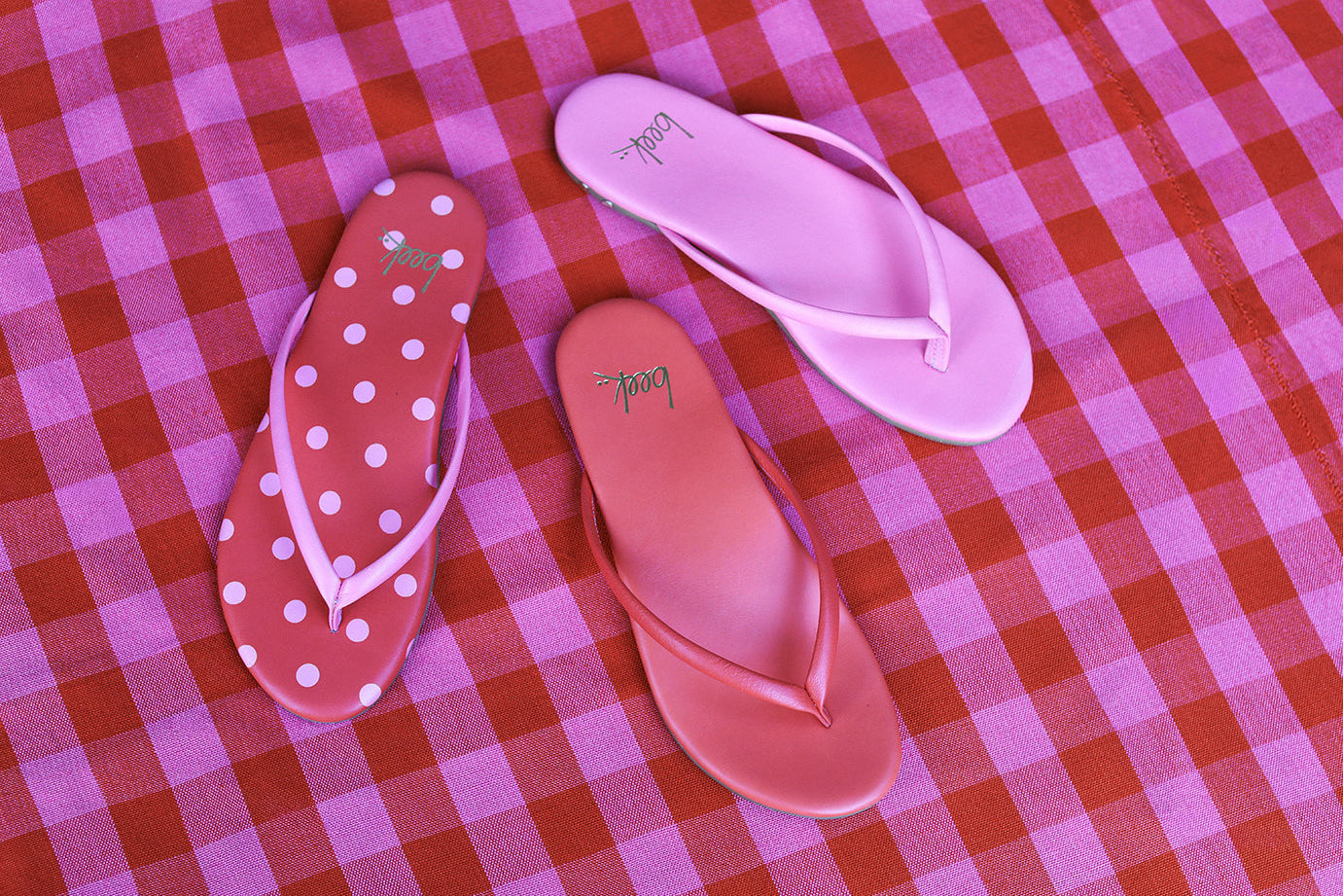 Group shot of Sunbeam leather flip flop sandal in peony/tomato, peony, and blossom