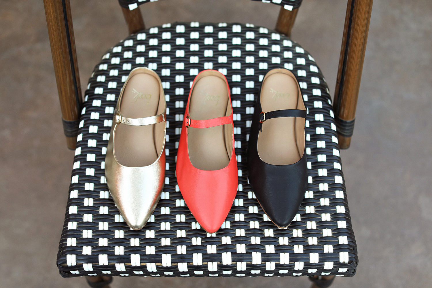 Group shot of Swallow leather ballet mule in black, gold, and tomato
