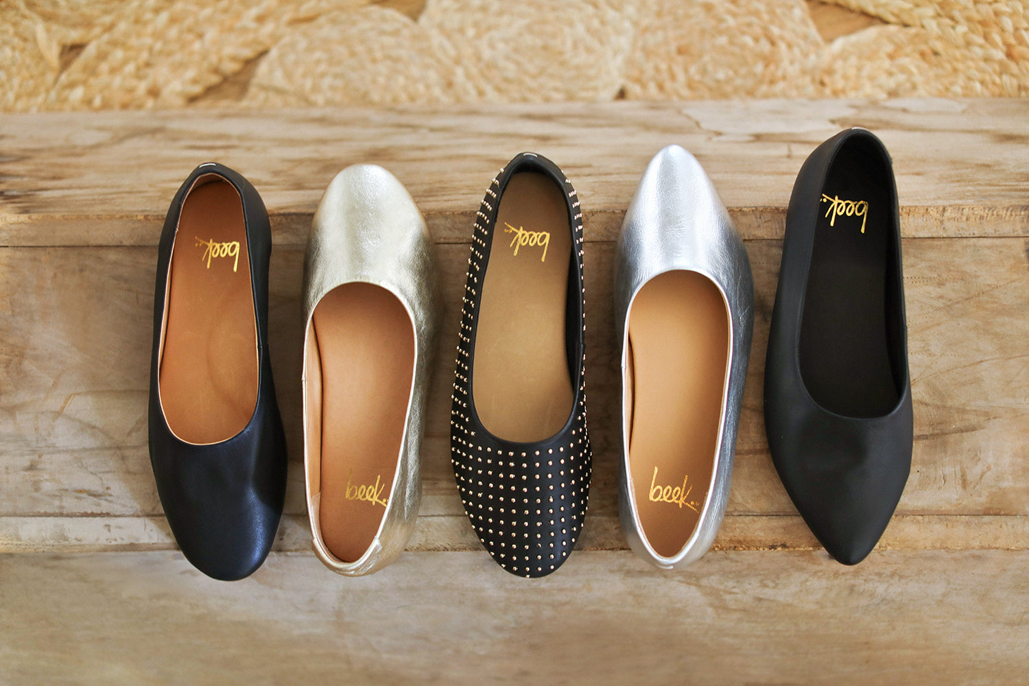 Group shot of Swiftlet leather ballet slippers in black and silver, Swiftlet Stud leather ballet slippers in black, and Swoop leather ballet slippers in silver and black.