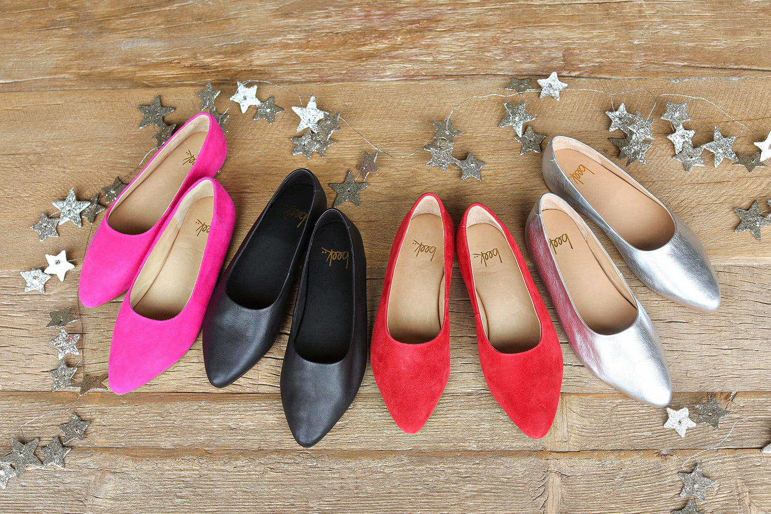 Group shot of Swoop ballet shoes in magenta suede, black leather, red suede, silver leather.
