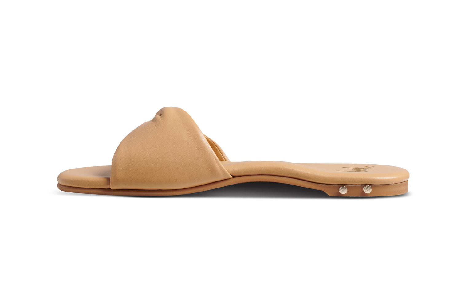 Whipbird leather slide sandal in beach - side shot