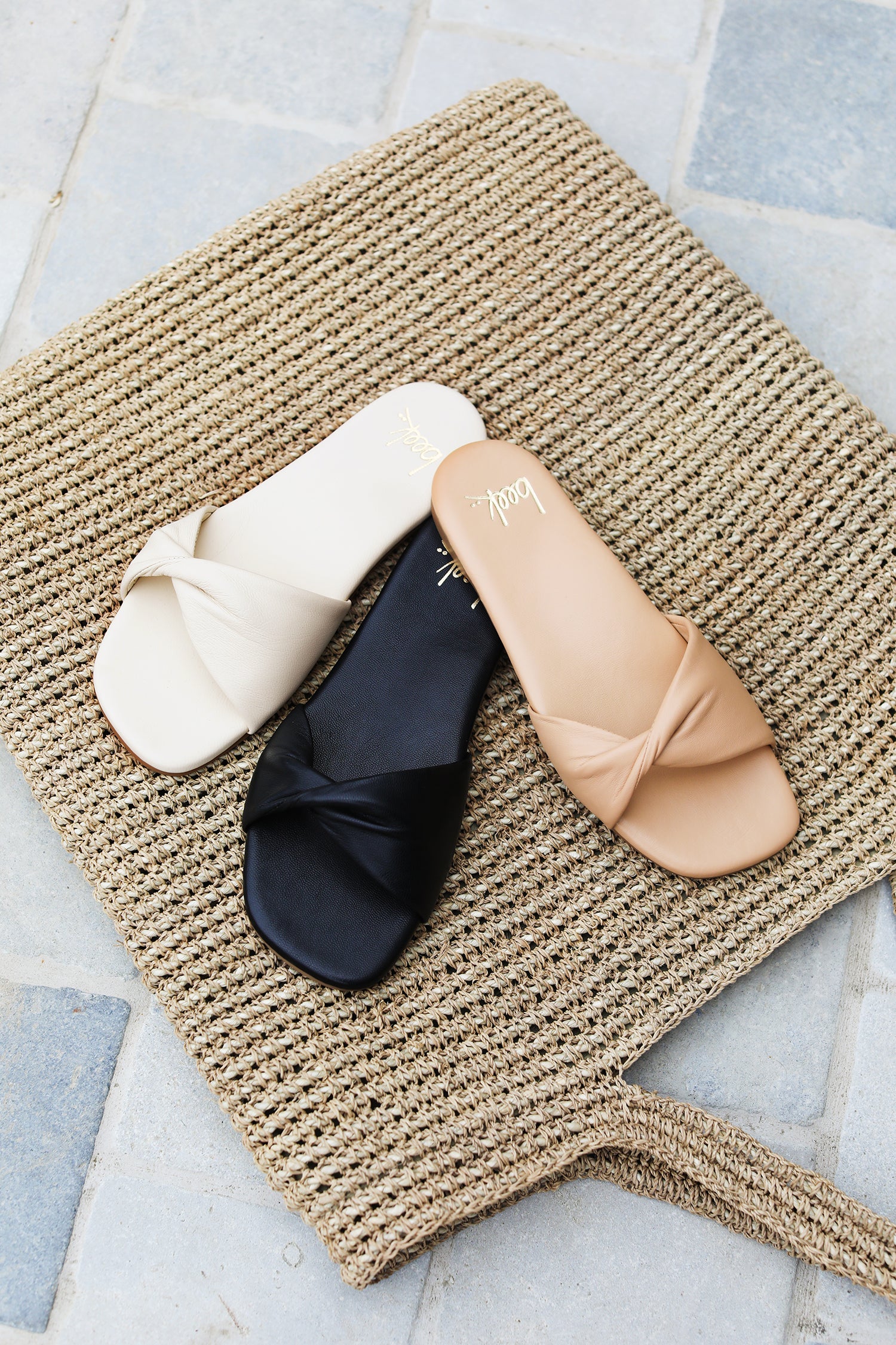 Whipbird leather slide sandal in beach, black, eggshell colors