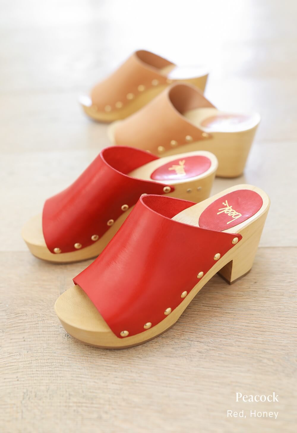 Group shot of Peacock clogs in red and honey