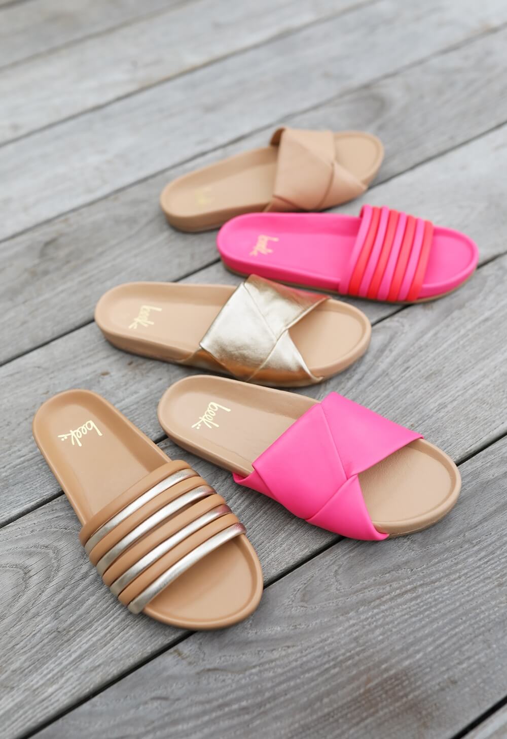 Group shot of Hoopoe slide sandals in gold/honey and azalea/cherry and Tori slide sandals in azalea/beach, gold/beach, and beach.