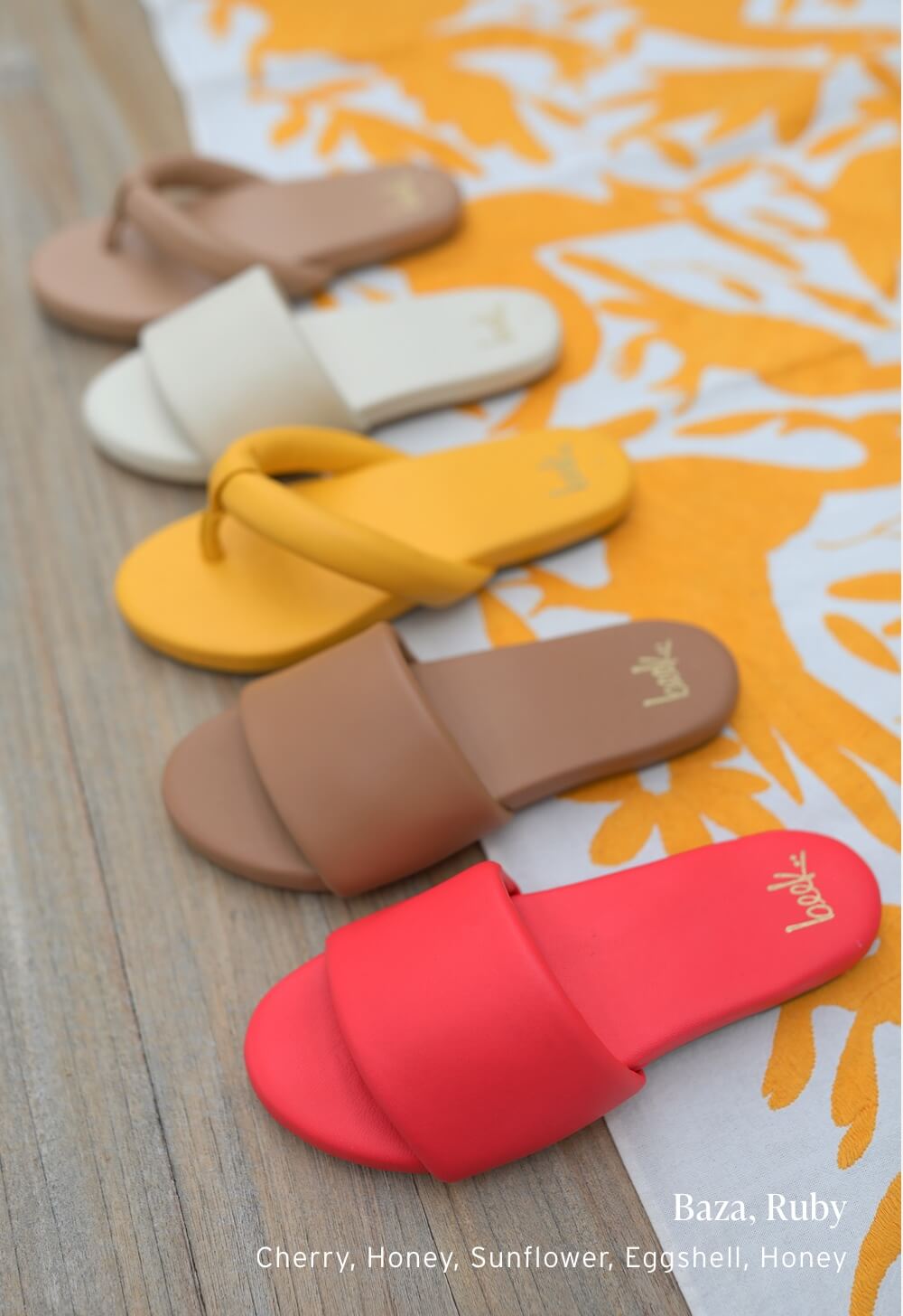 Group shot of Baza leather slide sandals in cherry, honey, eggshell with Ruby flip flop sandals in sunflower, honey