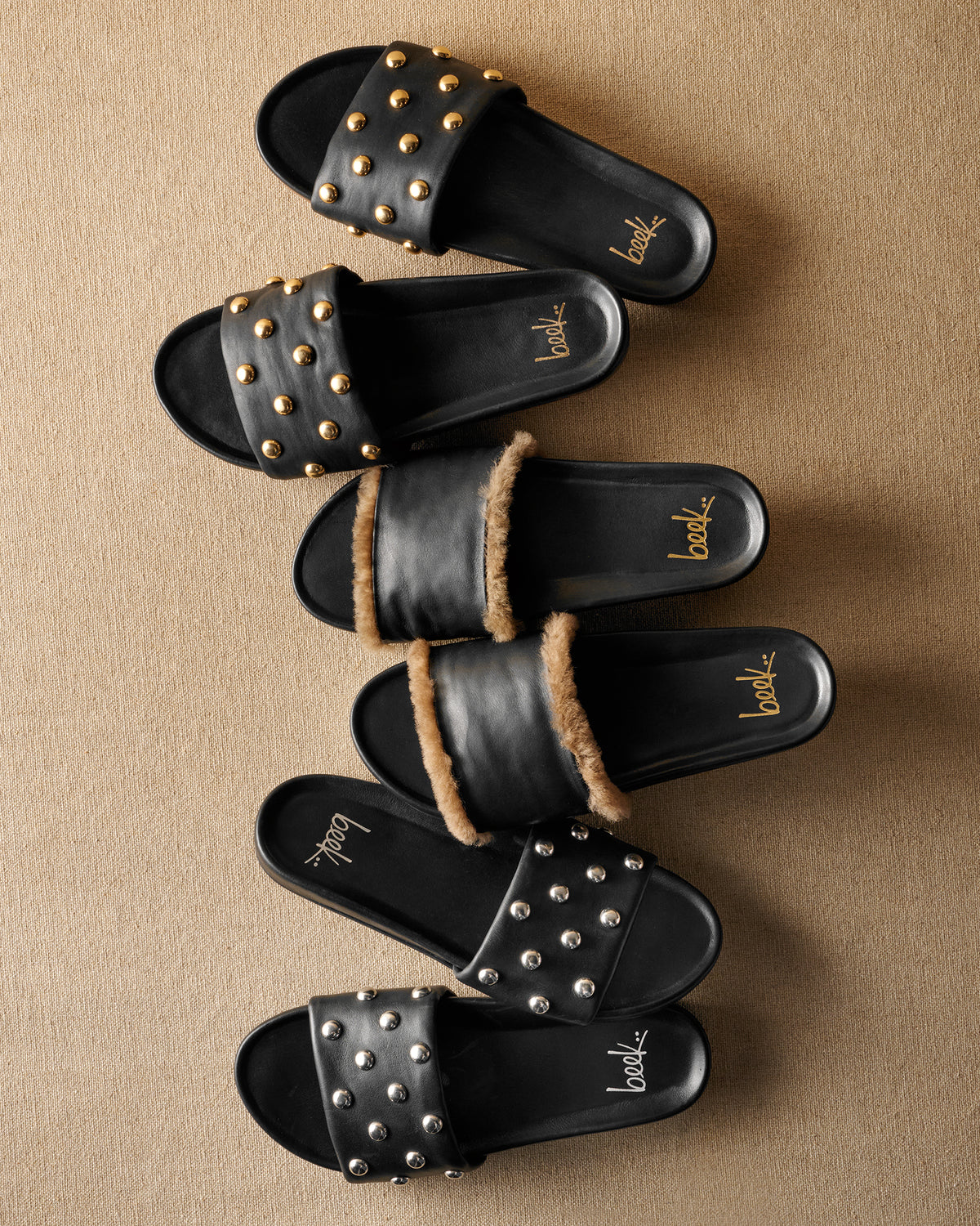Group shot of Gallito Stud slide sandals in black gold and black silver with Gallito Shearling sandals in black leather