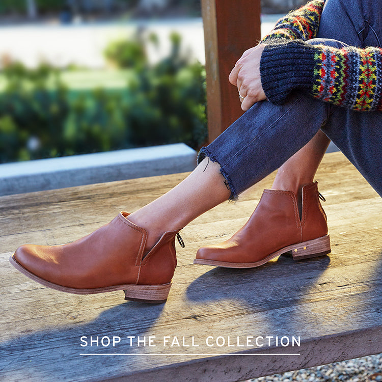 Woman wearing Falcon leather bootie in cognac with link to Shop the Fall Collection.