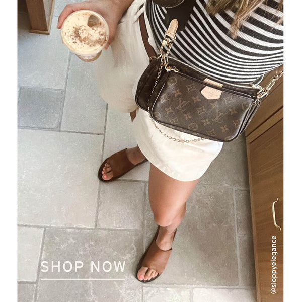 Influencer @sloppyelegance wearing Broadbill leather slides in cognac with cream shorts and striped top.