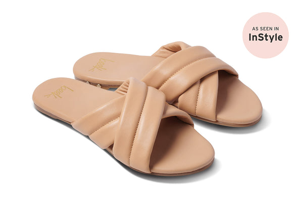 Surfbird leather slide sandal in beach - product angle shot - as seen in InStyle