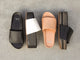 Group shot of Albatross leather platform slide sandal in black, eggshell/black, and beach and Albatross Textile leather platform slide sandal in black.