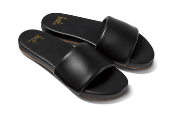 Baza leather slide sandals in black - angle shot