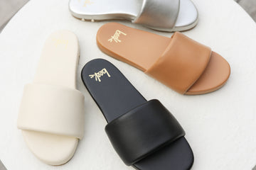 Baza leather slide sandals in silver, honey, black, eggshell.