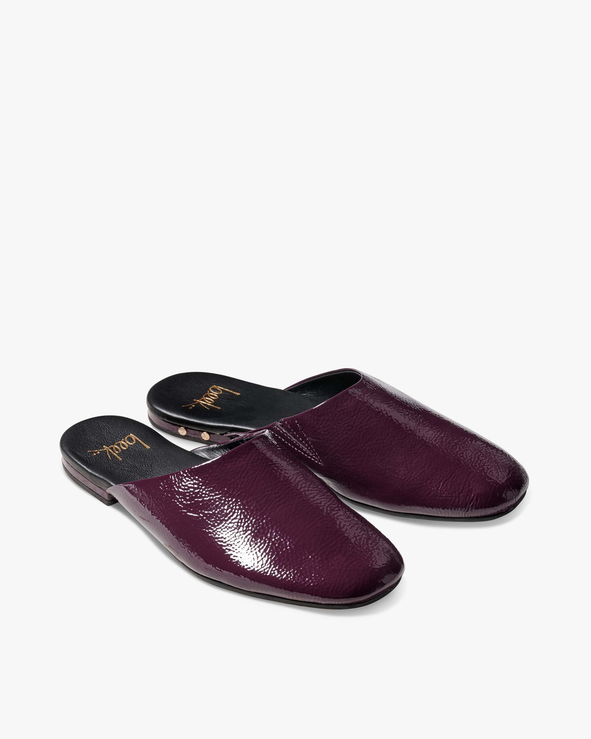 Blackbird patent leather mules in prune - product angle shot