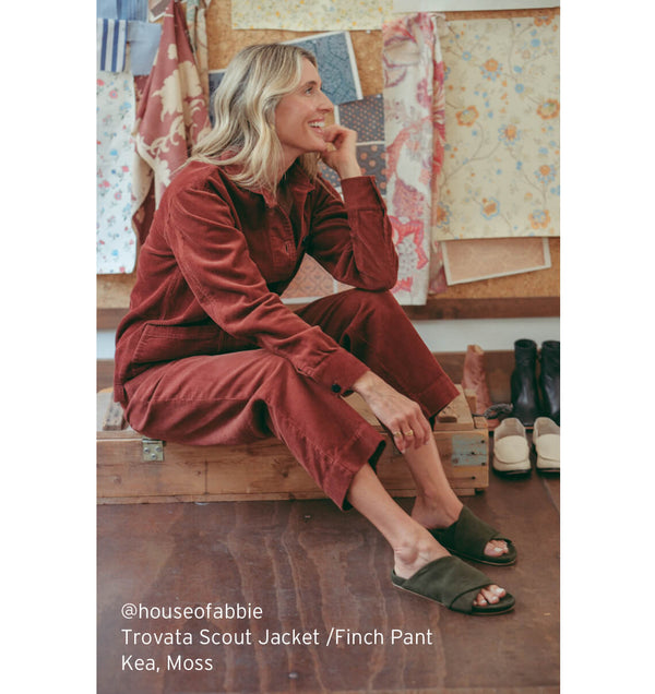 @houseofabbie wearing Trovata Scout jacket and Finch pants with beek Kea suede sandals in moss.
