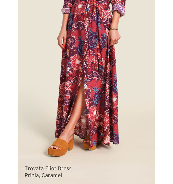 Woman wearing Trovata Eliot dress and beek Prinia platform heeled sandals in caramel suede.