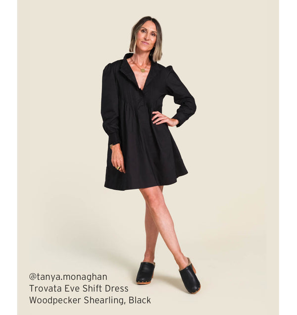 @tanya.monaghan wearing Trovata Eve shift dress with Woodpecker Shearling clogs in black.