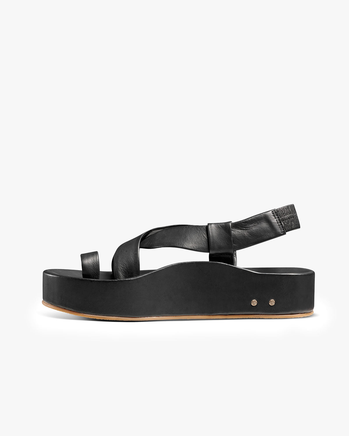 Woman wearing Caracara leather platform sandal in vanilla by the pool