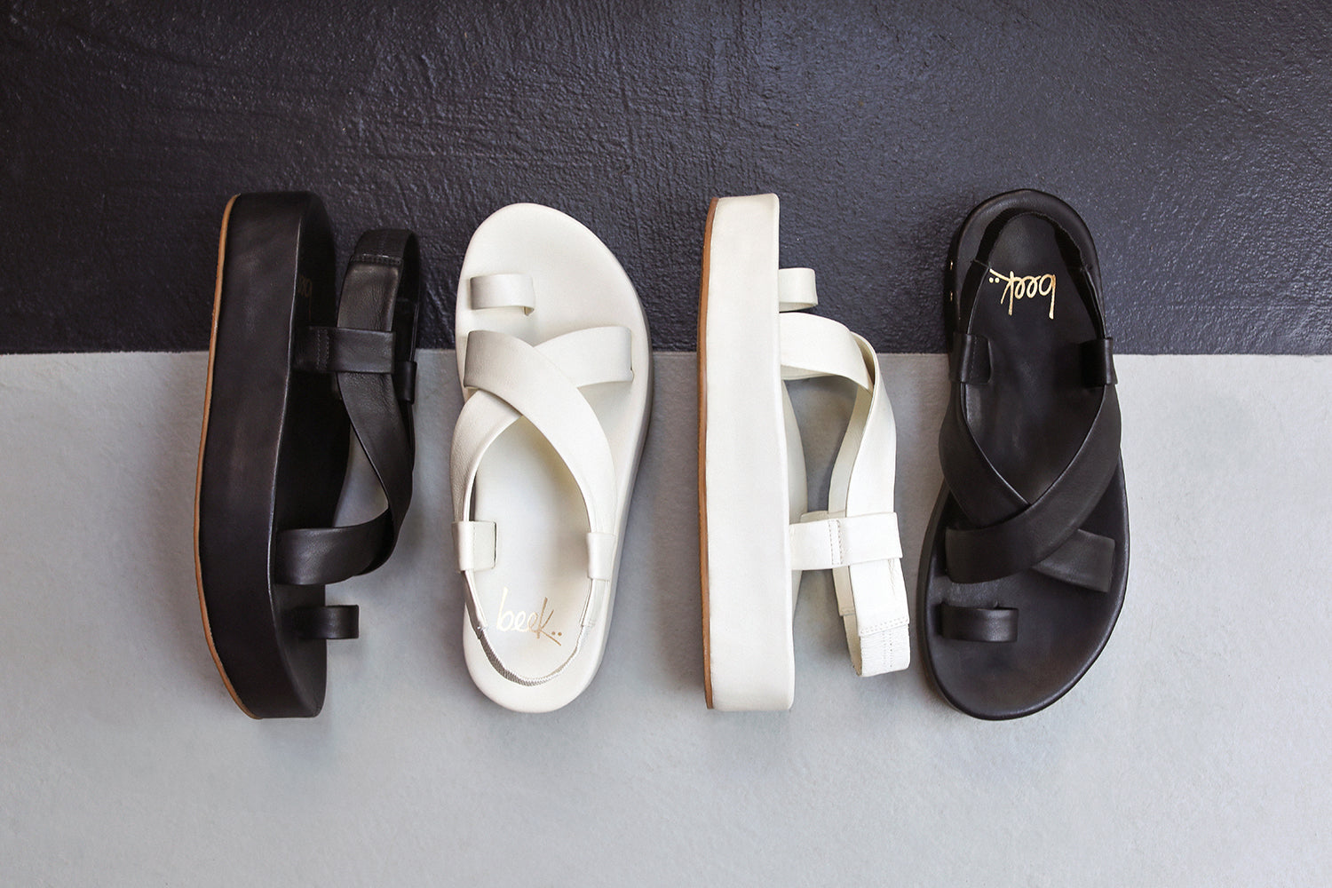 Group shot of Caracara leather platform sandal in black and vanilla