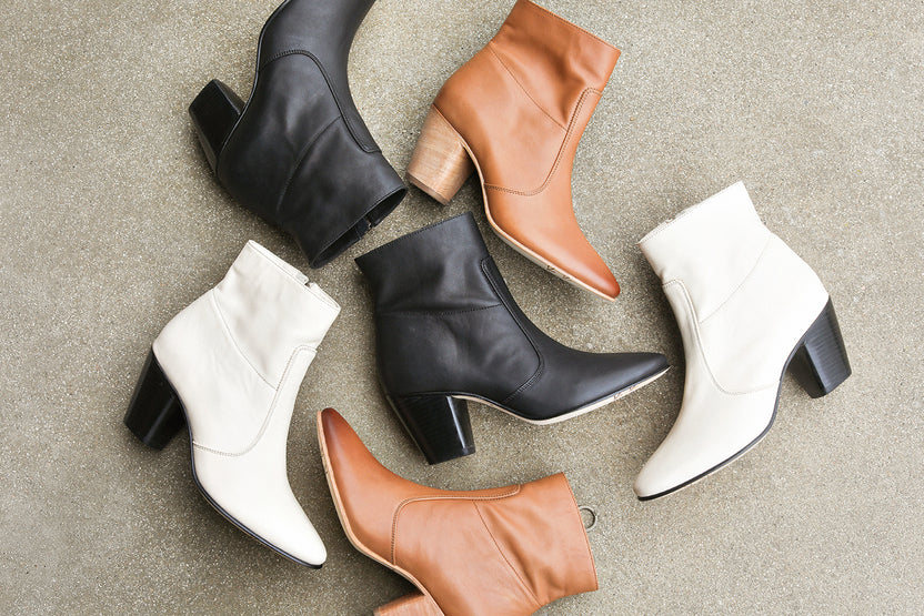 Group shot of Catbird leather boots in black, tan, and eggshell.