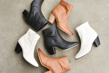Group shot of Catbird leather boots in black, tan, and eggshell.