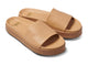 Chick leather platform slide sandals in beach - angle shot
