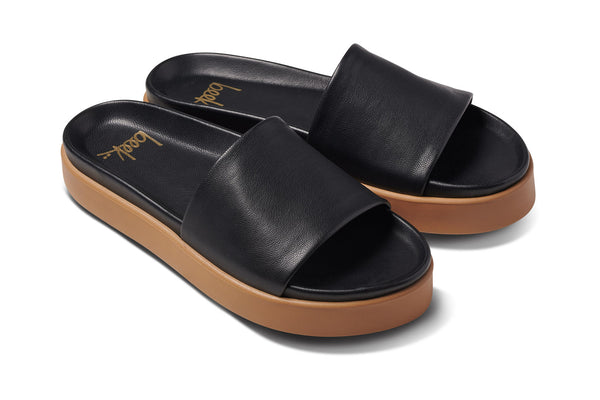 Chick leather platform slide sandals in black - angle shot