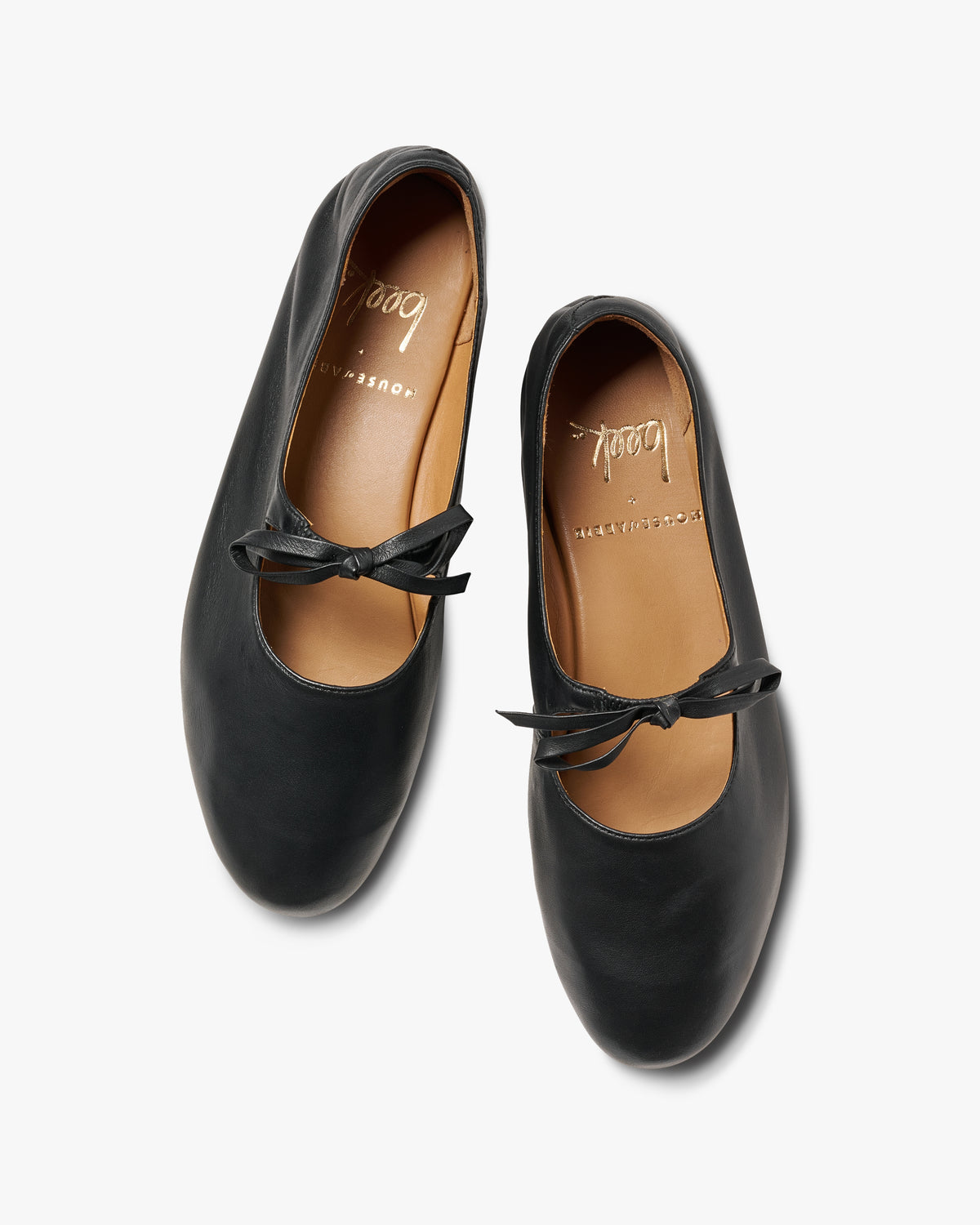 Crane bow leather mary jane shoes in black - product top shot