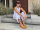 Abbie Crane @houseofabbie wearing Crane suede mary jane shoe in caramel with white pants and tank top.
