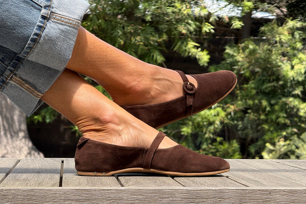 Woman wearing Crane suede mary jane shoe in coffee with jeans