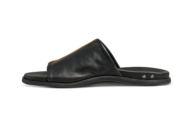 Crest leather slide sandals in black with tan stripe - product side shot