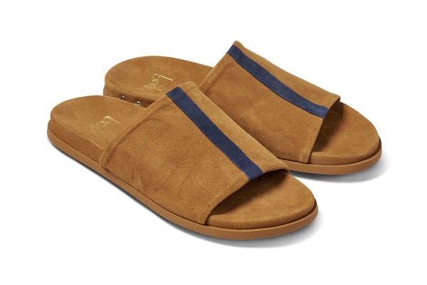 Crest suede slide sandals in caramel with navy stripe - product angle shot