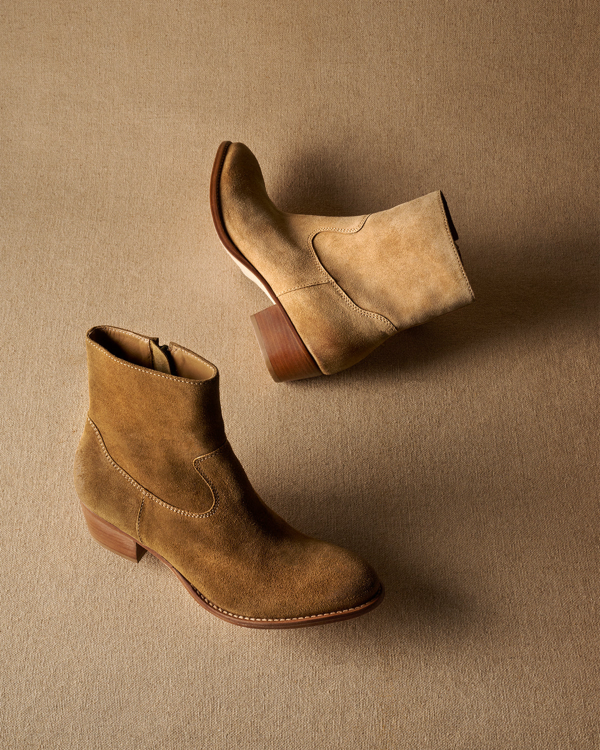 Group shot of Cuervo suede boots in chestnut and oat