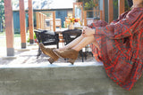 Woman wearing Eaglet suede boot in chestnut and dress.