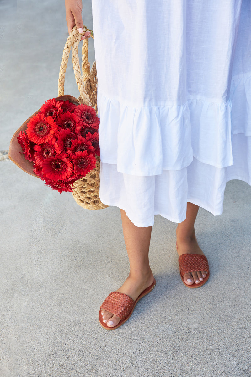 Woman wearing Fairy woven leather sandals in tan 