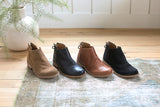 Falcon boots in chestnut suede, black leather, cognac leather, and black suede.