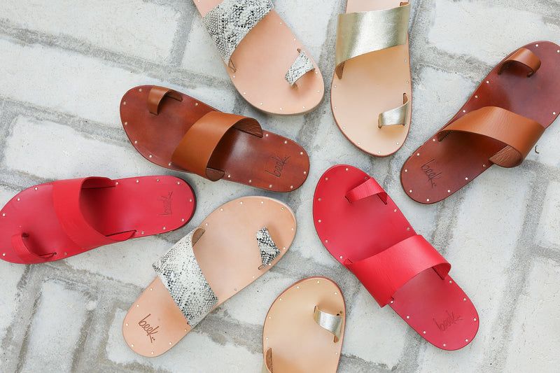 Group shot of Finch leather toe-ring sandals in tan, platinum/honey, and snake/beach