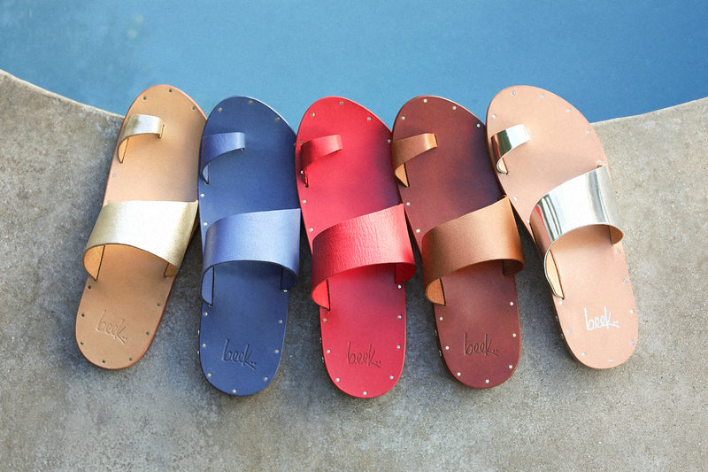 Group shot of Finch leather toe-ring sandal platinum/honey, navy, lipstick, tan, high shine silver