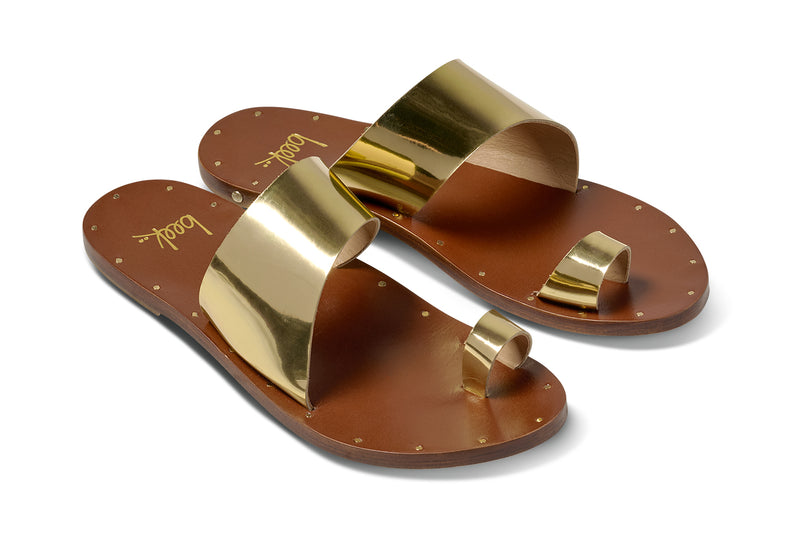 Finch leather toe-ring sandal in high shine gold - product angle shot