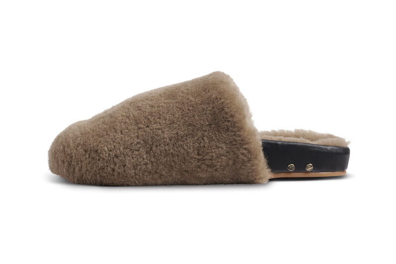 Flufftail shearling mules in bronze/black - side shot
