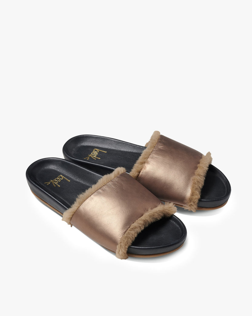 Gallito Shearling leather slide sandals in mocha/black - product angle shot