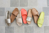Gallito leather slide sandals in platinum, honey, coral, celery with Tori leather slide sandals in macadamia and beach